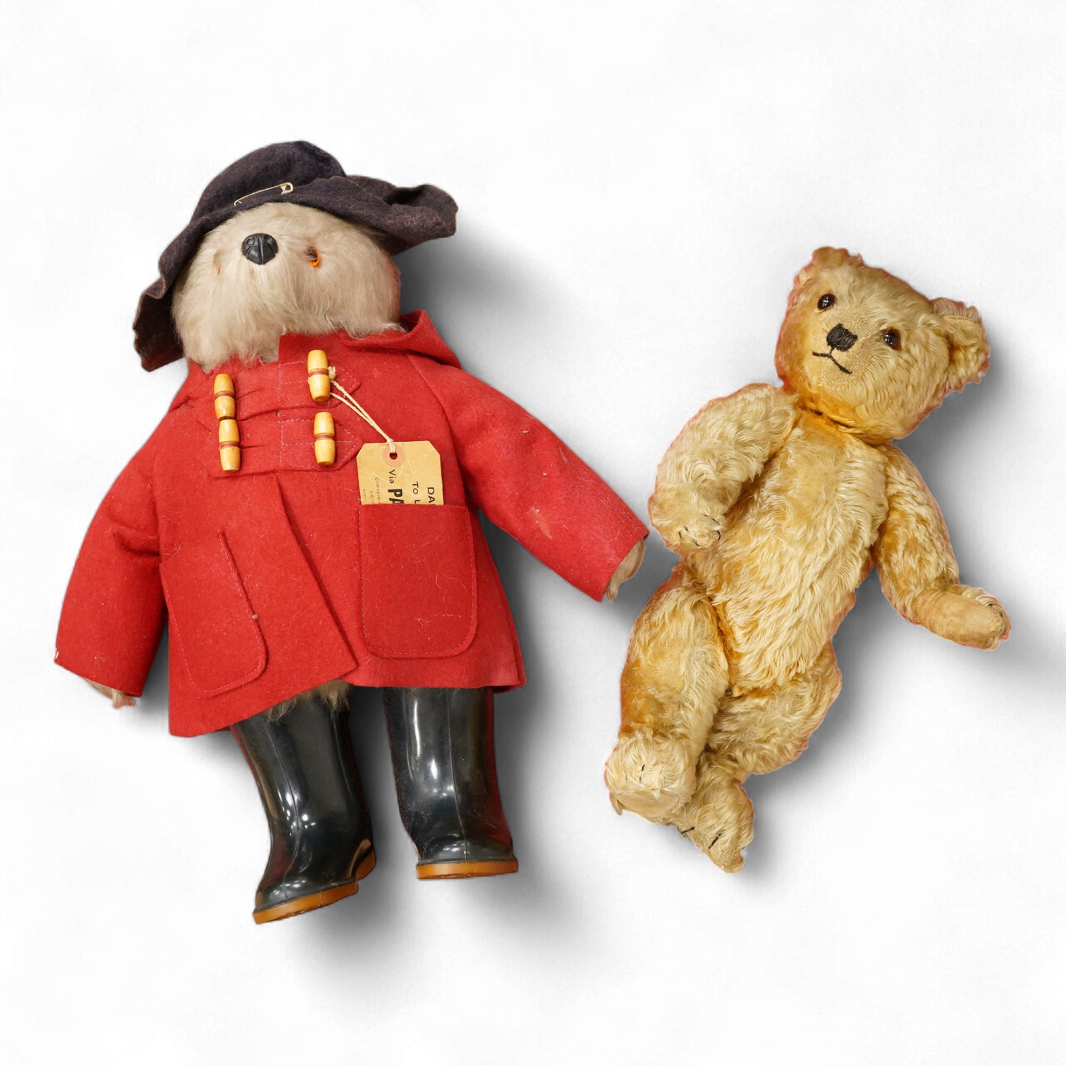 An English 1930s teddy bear and a Paddington Bear by Gabrielle Designs with original labels
